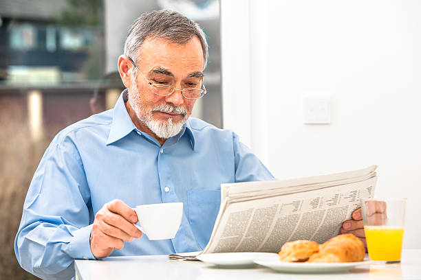 istock Senior man with newspaper 467446365