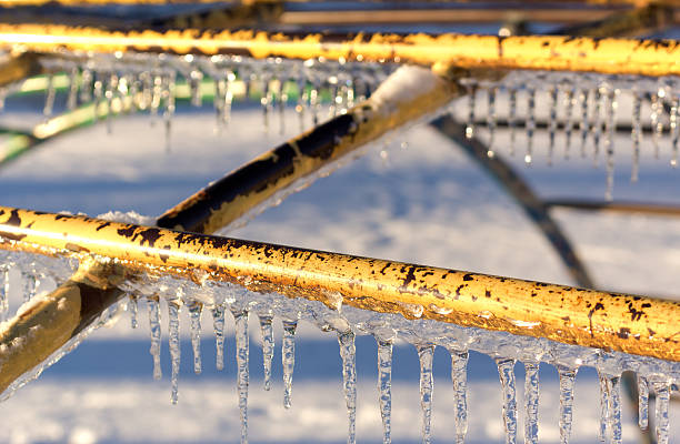 istock Icicles on playground equipment after an ice storm. 467446515