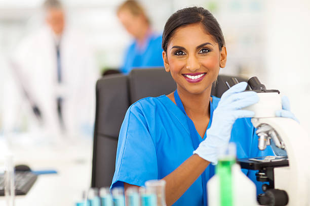 indian lab technician working in the laboratory stock photo