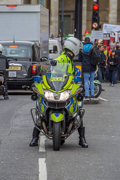 London UK - 21st March 2015: Police Officer on their motorbike at The Stand Up to Racism & Facism march through London.