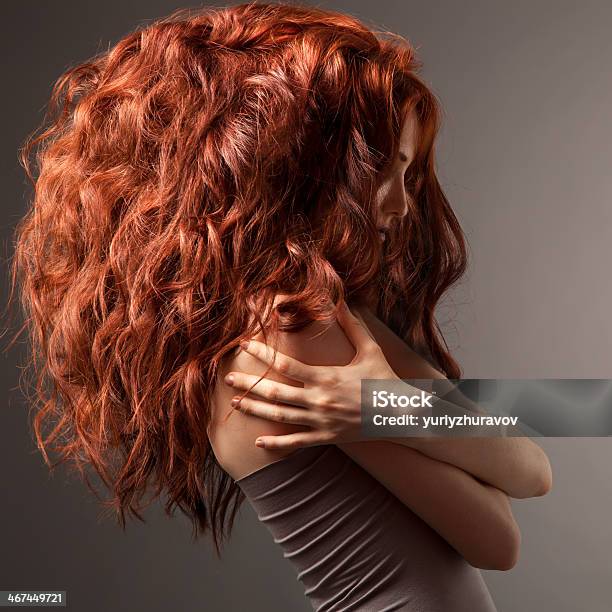 Beautiful Woman With Curly Hairstyle Against Gray Background Stock Photo - Download Image Now