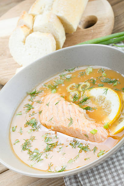 istock Salmon soup on wooden desk background 467454384
