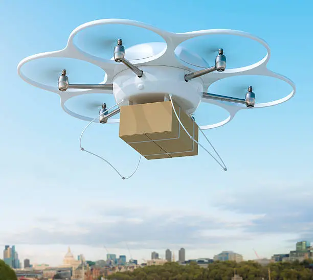 Hexacopter drone carrying a shipment in a city.