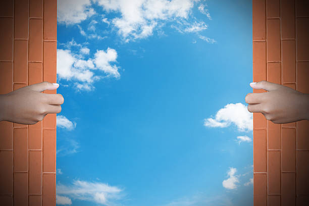 istock Two hands to open the door world map background 467455158
