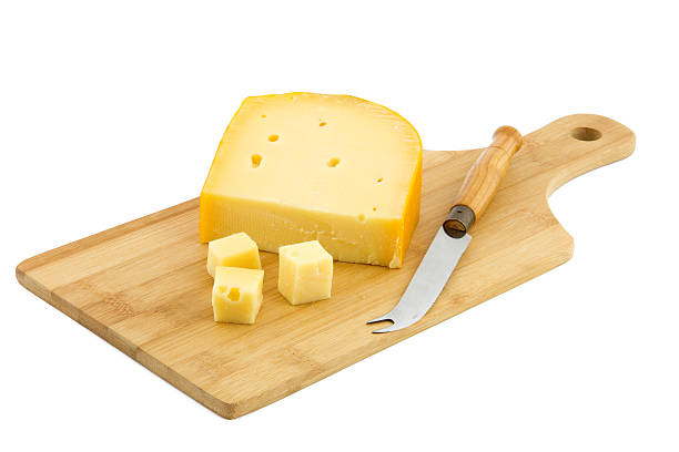 istock cutting board and piece of Dutch cheese 467455203