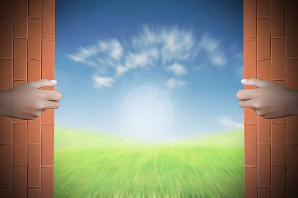 istock Two hands to open the door world map background 467455552