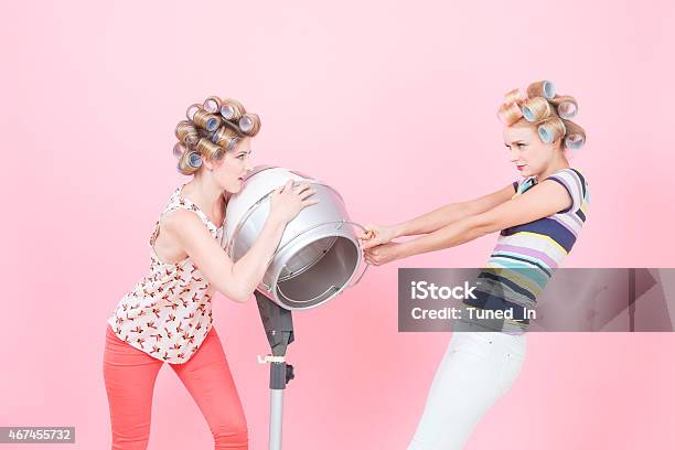 Young Woman With Curlers Quarreling About Hood Drier Stock Photo - Download Image Now