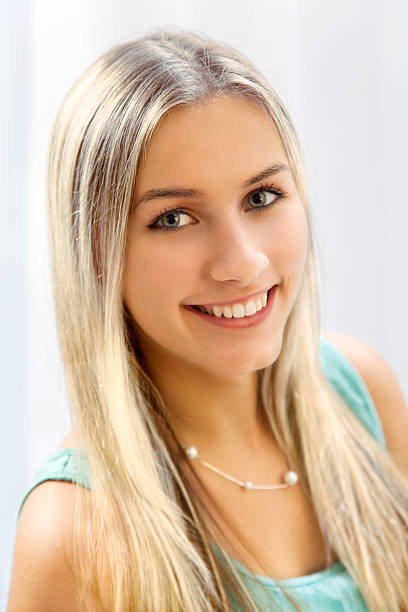 istock Blonde with long hairs is smiling 467459866