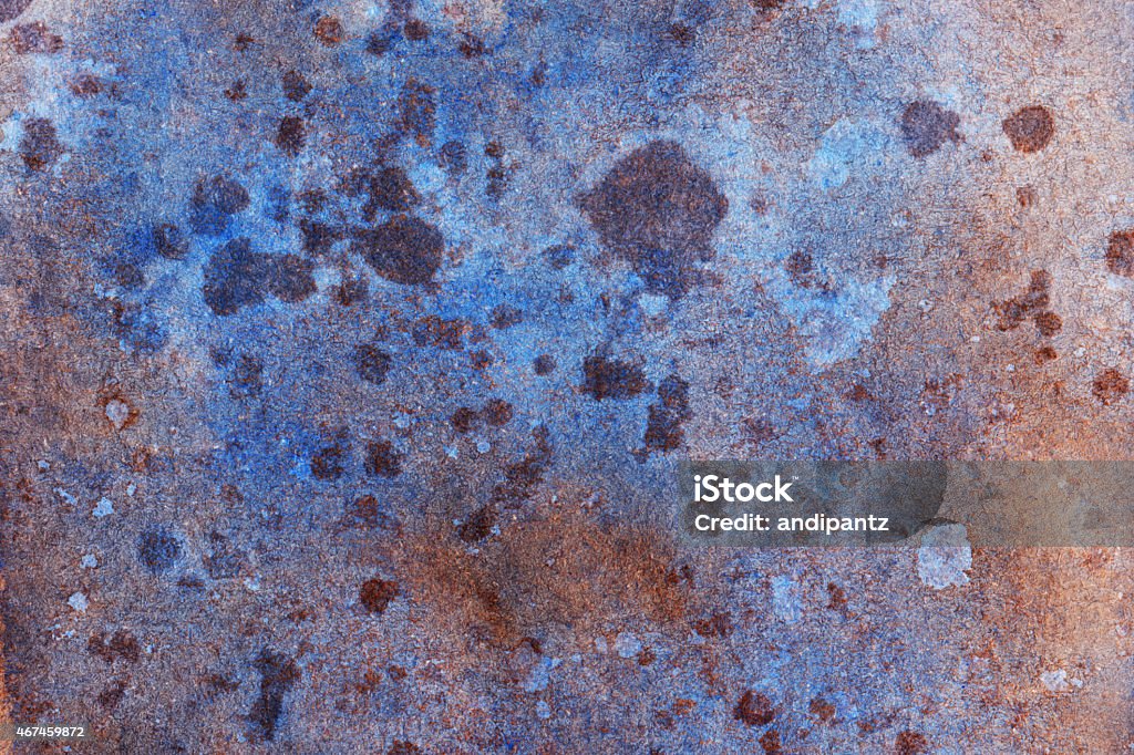Splattered blue and brown texture on paper A hand painted watercolor background. The prominent colors in this painting are blue, brown and slight violet colors. There are textures of brush strokes and paint splatters throughout the painting. 2015 Stock Photo