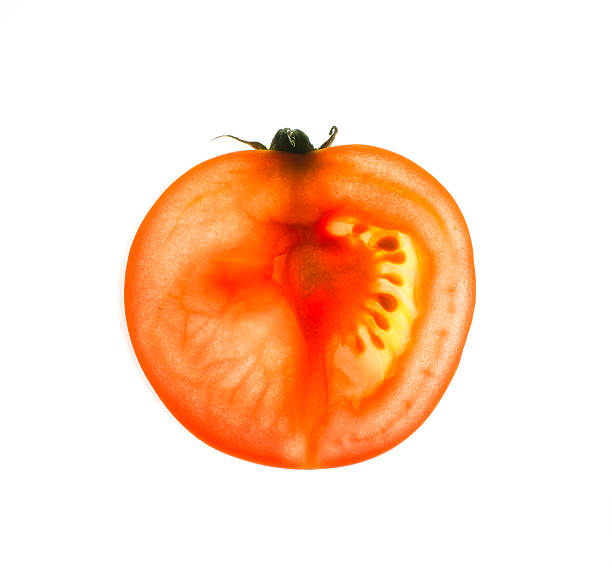 istock Tomatoes. Whole and a half isolated on white 467460792