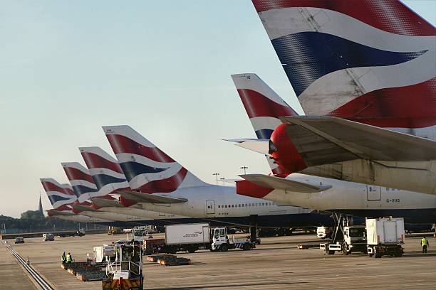 British Airways aircrafts in a row at London Heathrow, UK London, UK - September 15, 2013: A row of British Airways aircrafts at London's Heathrow Airport british airways stock pictures, royalty-free photos & images