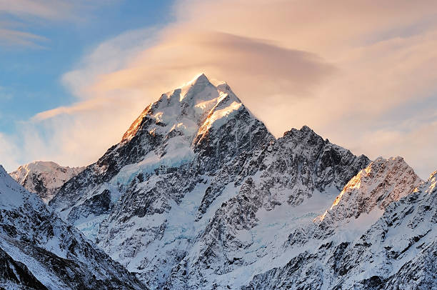 Cloud over Mount Cook, New Zealand Sunset cloud on top of Mount Cook, the highest mountain in New Zealand. The image were taken in Aoraki Mount Cook National Park, mt cook photos stock pictures, royalty-free photos & images