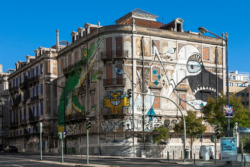 Lisbon, Portugal - November 24, 2013:  Abandoned houses with big graffiti in Lisbon.
