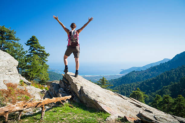 istock Man standing on a rock and enjoying the view 467464291