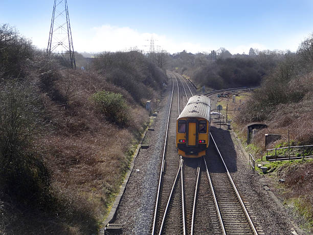 istock Image of railway line / railroad tracks, junction-box, diesel train, electricity-pylon 467464404