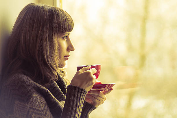 istock Coffee. Pretty Girl drinking Coffee . Warm colors toned 467467595