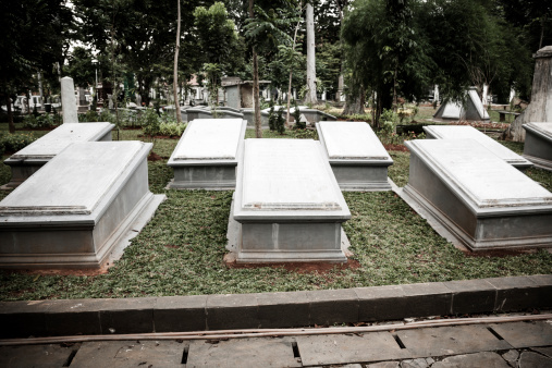 Jakarta, Indonesia - January 11, 2014: Tombstones in very old cemetery Museum Prasasti