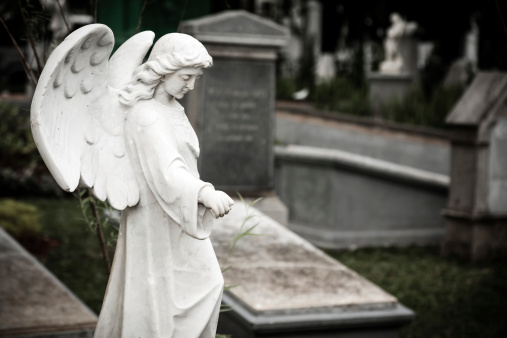 Jakarta, Indonesia - January 11, 2014: Statue of Angel in old cemetery Museum Prasasti