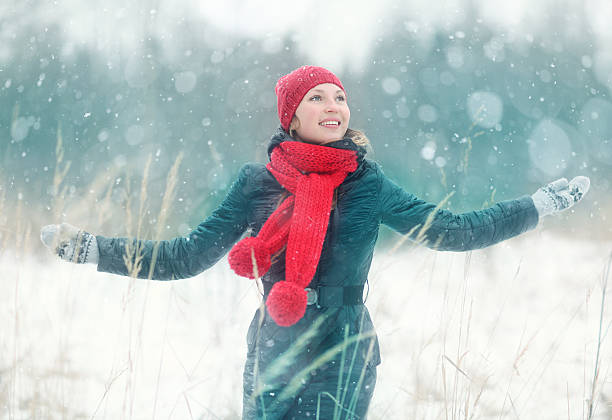 istock happy girl winter snow runs 467470686