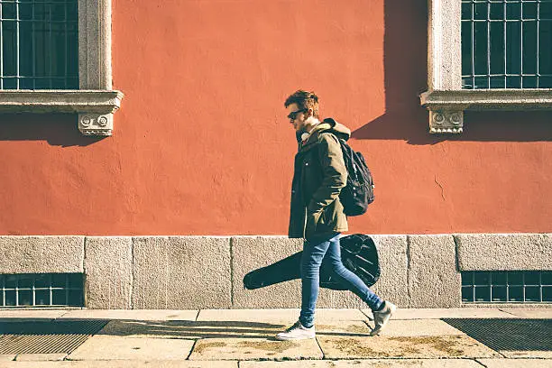 Photo of Musician Walking The Street