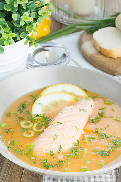 istock Salmon soup on wooden desk background 467475968