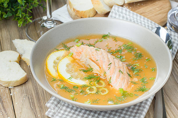 istock Salmon soup on wooden desk background 467475990