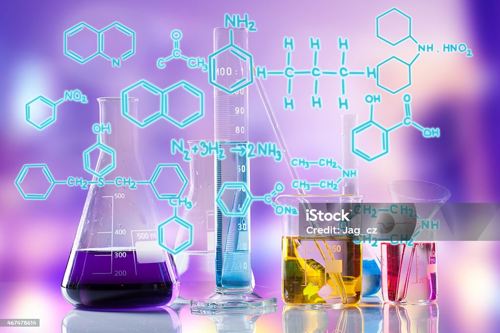 Laboratory tubes Laboratory tubes with colored liquids inside and formula on foreground 2015 Stock Photo