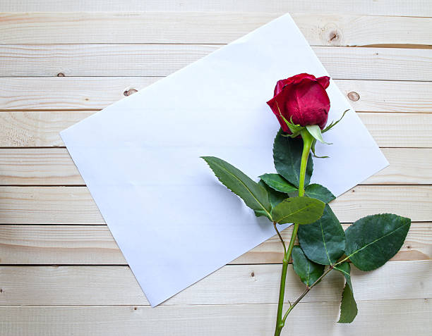 istock Red rose on a wooden table 467478856