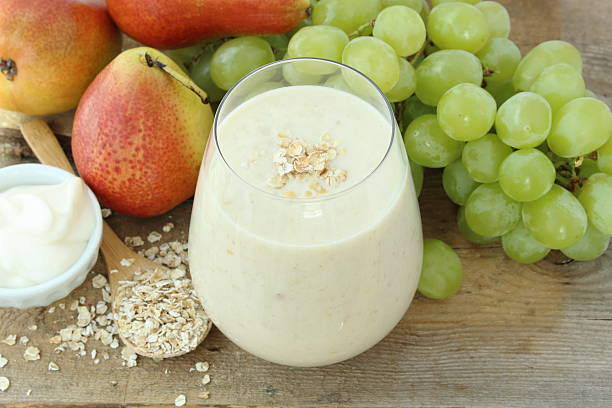 Oatmeal breakfast smoothie with grapes, pear and yogurt