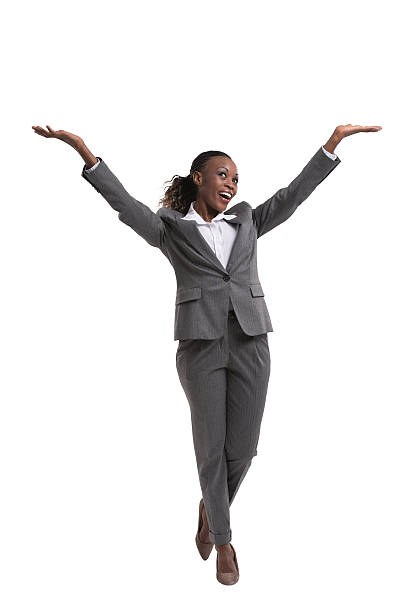 Happy african businesswoman with hands raised isolated on white background Happy african businesswoman with hands raised isolated on white background arms raised women business full length stock pictures, royalty-free photos & images