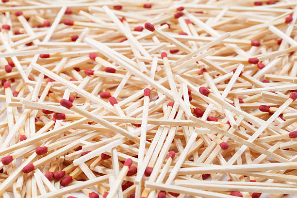 Matchsticks Pile Close-up of a pile of matchsticks background. unlit match stock pictures, royalty-free photos & images