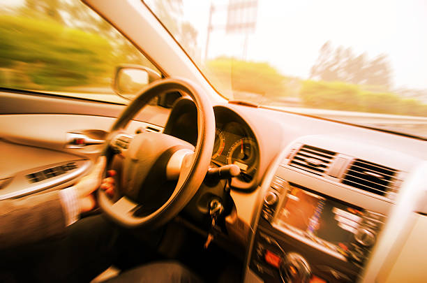 Driving car on empty road stock photo