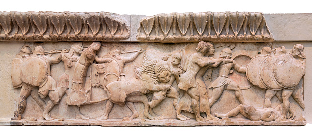 Marble frieze found in the city of Delphi depicting the fight between Giants and lions along with Troy warriors. It's a very old archeological sculptural frieze depicting Greek Mythology