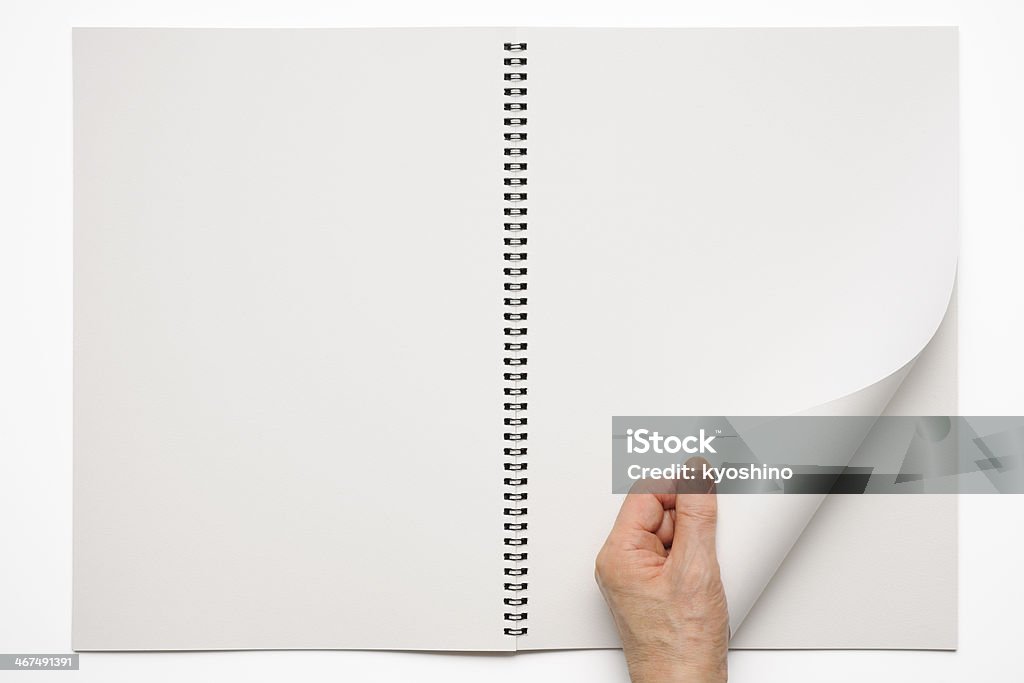 回転 sketchbook を空白ページを手を白背景 - 本のロイヤリティフリーストックフォト