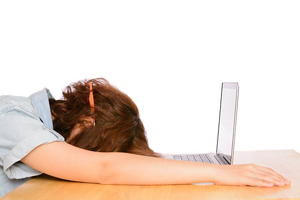 istock Tired sleeping Asian woman on office desk 467491470