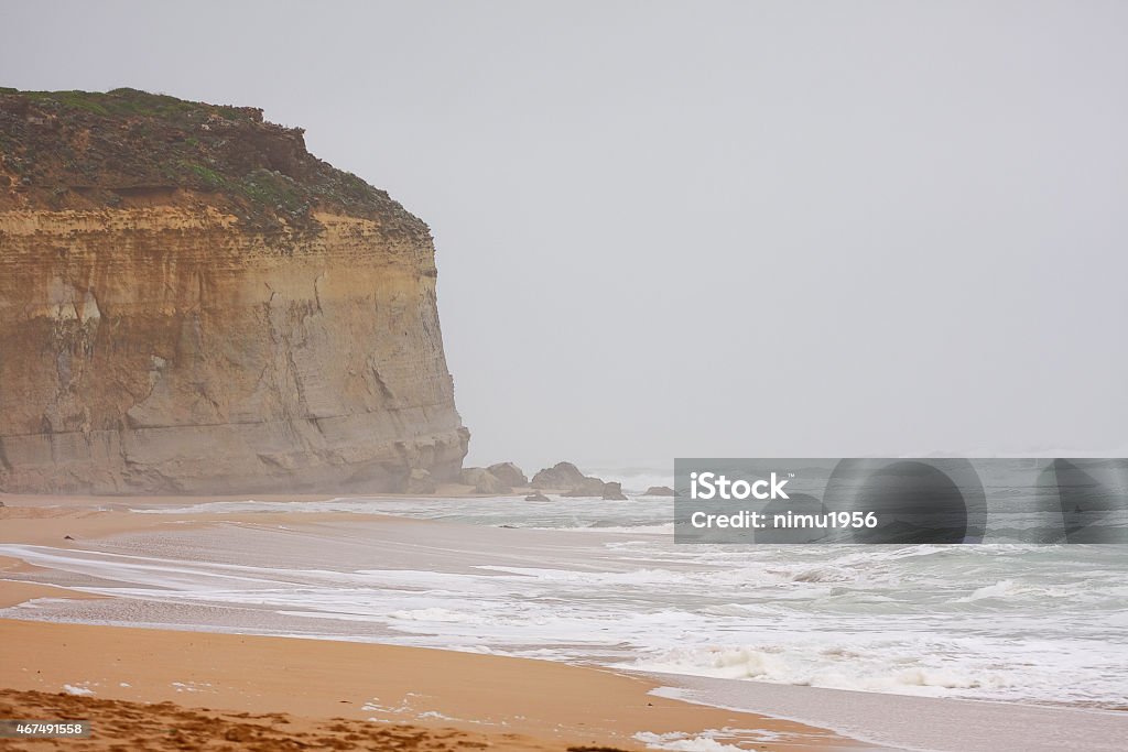 Twelve Apostles in Princetown-Victoria. Australia The famous Twelve Apostles rock formation on the Great Ocean Road  while it is strongly raining, Victoria, Australia 2015 Stock Photo