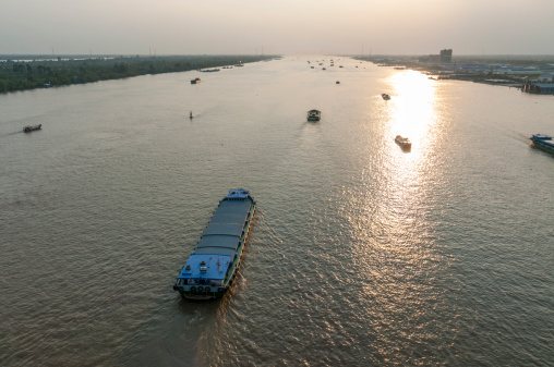 The Ben Nghe River And A Barge Carrying Sand In Ho Chi Minh City (Saigon) In Vietnam