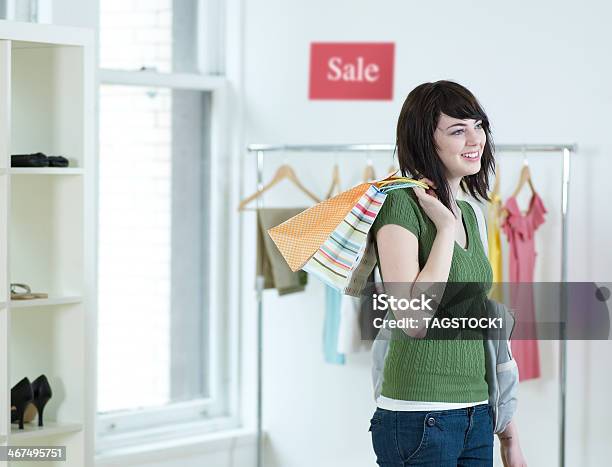 Young Woman Shopping In Clothes Store Stock Photo - Download Image Now - 18-19 Years, Adult, Adults Only