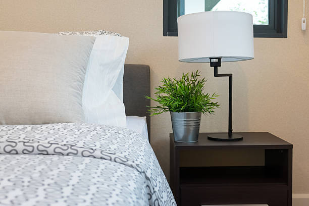 istock modern bedroom with white lamp and plants on table 467497218
