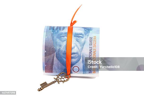 Swiss Franc Note And Key To Success With Red Bow Stock Photo - Download Image Now - 2015, Currency, Curve