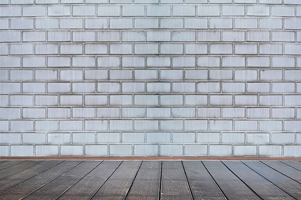 istock Background of aged grungy textured white brick and stone wall 467498404