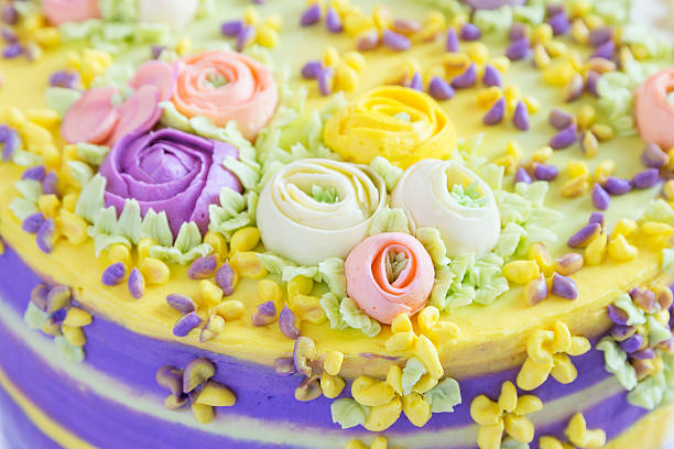 Bright aster flowers decorate a beautiful birthday cake.