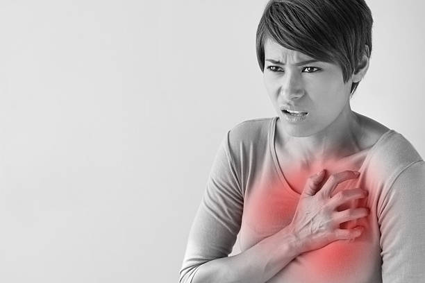 istock sick woman with sudden heart attack 467504442