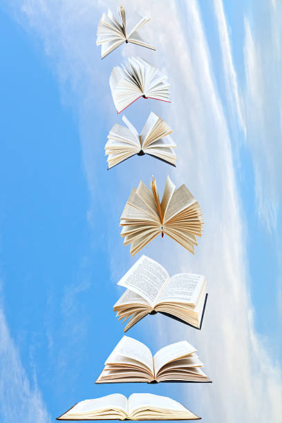 istock stack of books fly in blue sky 467506223