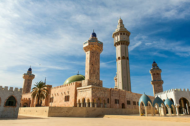 a mosque on a clear and sunny day - senegal stok fotoğraflar ve resimler