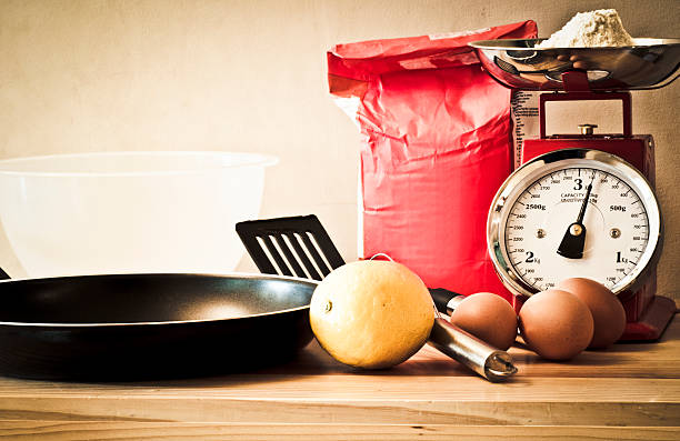Vintage cooking retro feel concept image of baking ingredients vintage kitchen scale with fruit stock pictures, royalty-free photos & images