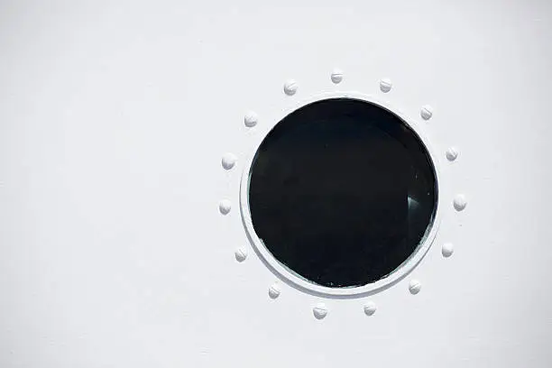 Close-up abstract view of a porthole
