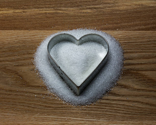 istock Heart shape cookie mold on a wood and sugar 467509929