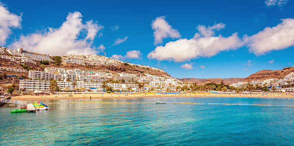 Panoramic view over beach and resort town of Puerto Rico on Gran Canaria.