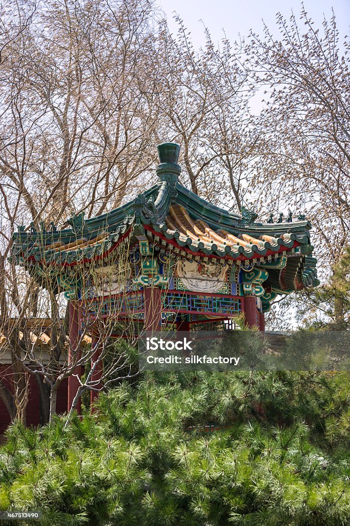 Wooden gazebo in Beijing park near the Forbidden City Wooden multi-colored gazebo in a park near the Forbidden City in Beijing in spring. 2015 Stock Photo